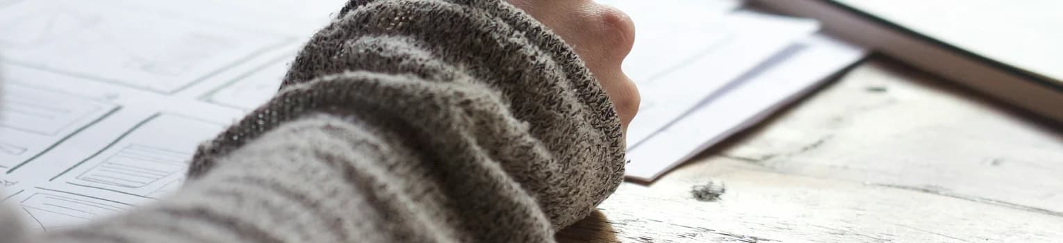 Travel blog banner image showing travel planning and writing notes